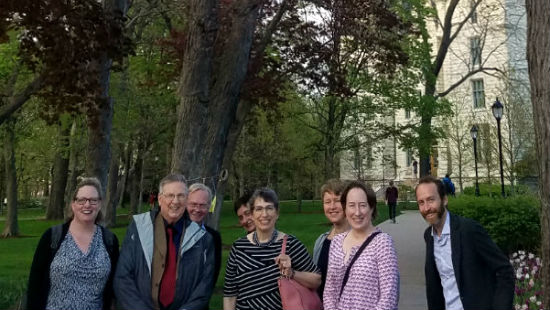 Robert Gordon and other guests outside under NU Arch.