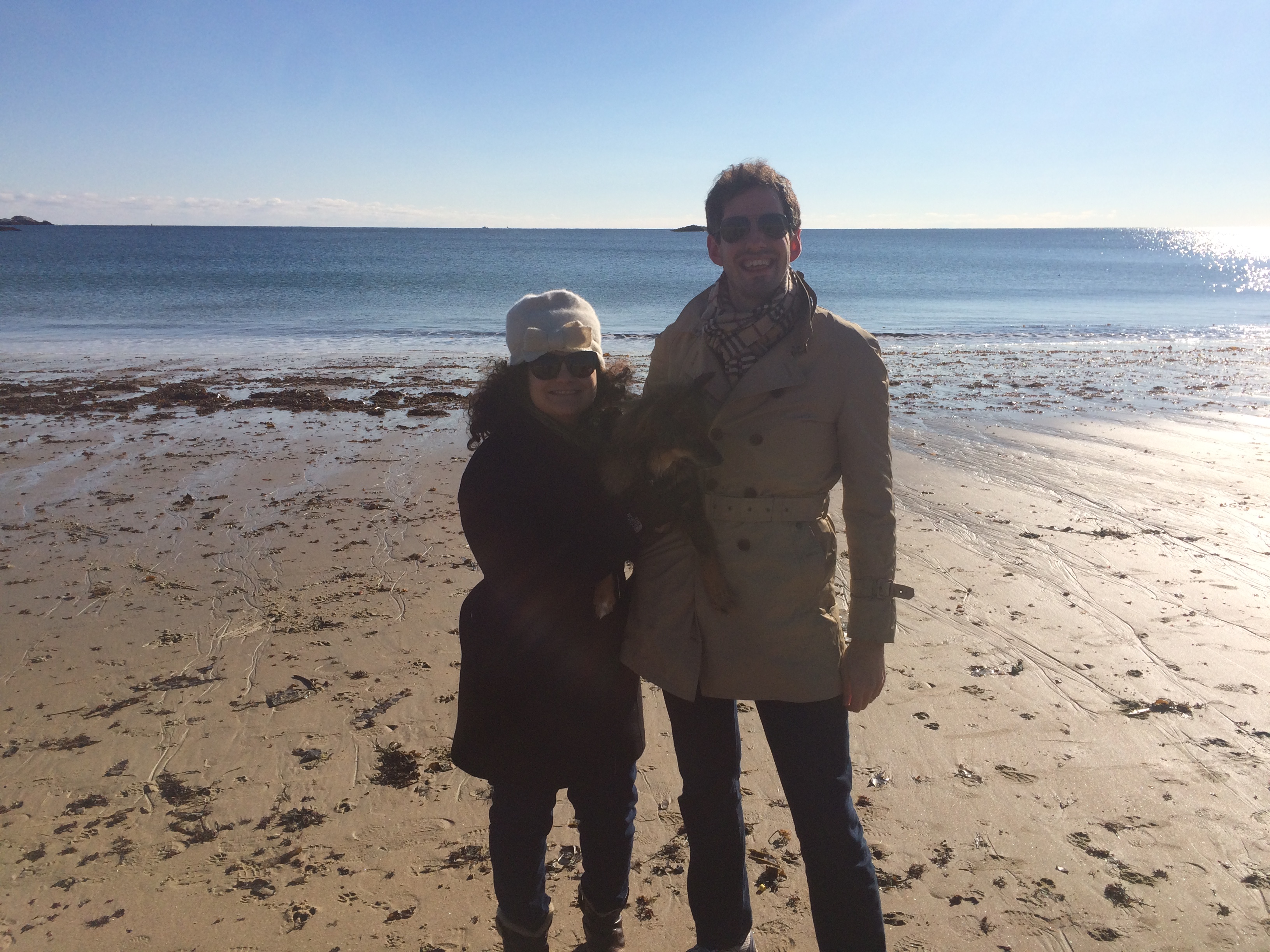 Lauren Weinstein, Geoff Derrick, and their dog at the beach